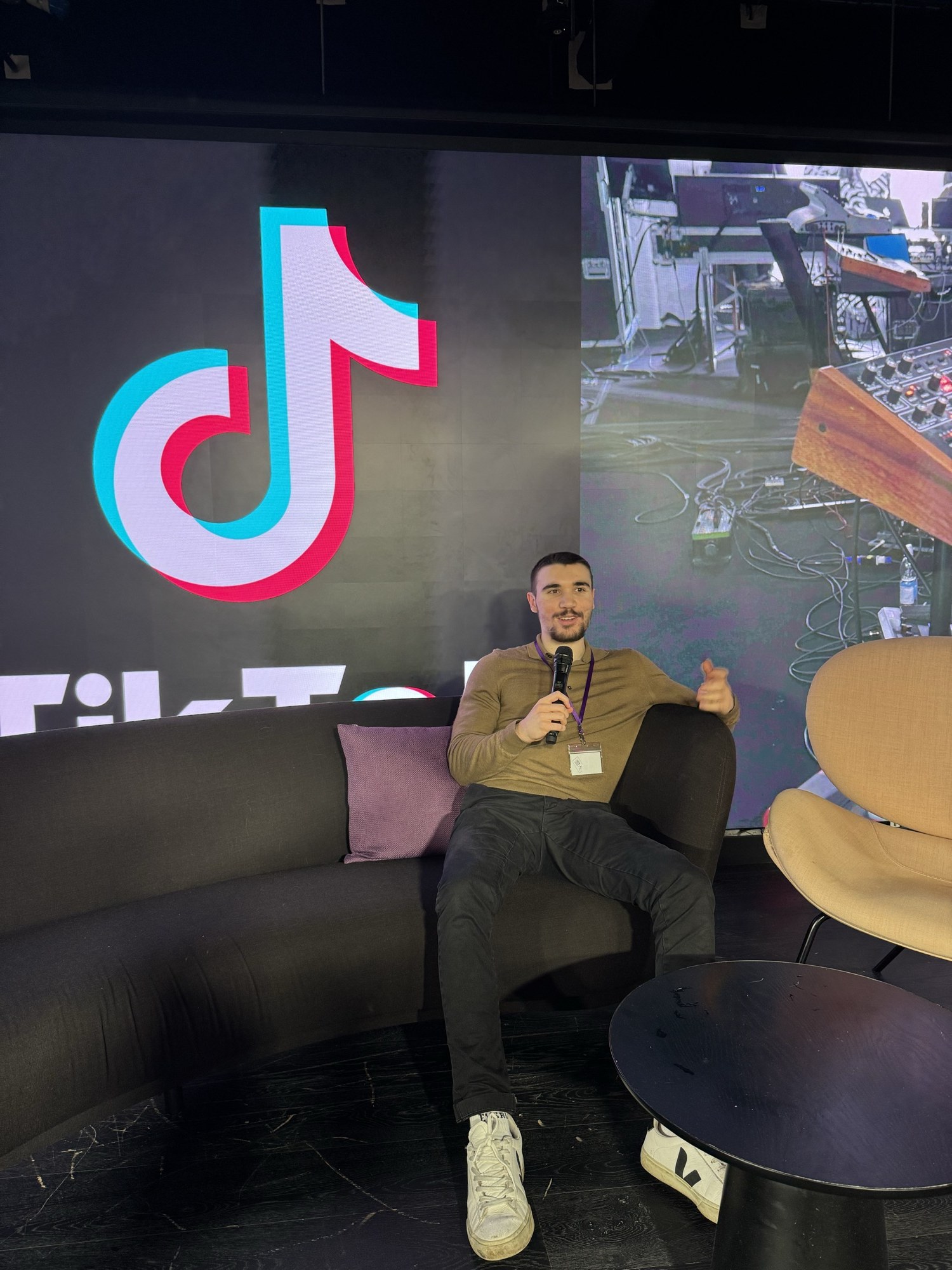 Deniz Sancar speaking on stage at TikTok